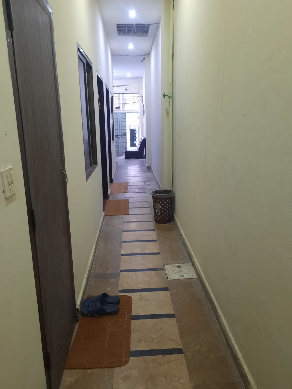 Clean Tiled Common Hallway at The Second Home Boys Hostel Lahore